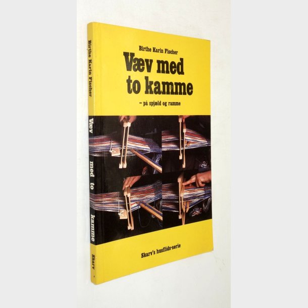 V�v med to kamme p� spj�ld og ramme: Birthe Karin Fischer